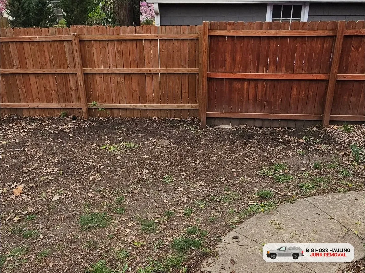 After: the fence line cleared to bare ground