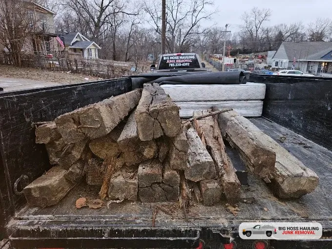 Old landscape timbers loaded in the trailer
