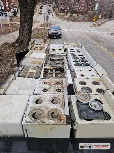 A trailer loaded with old stoves and ranges