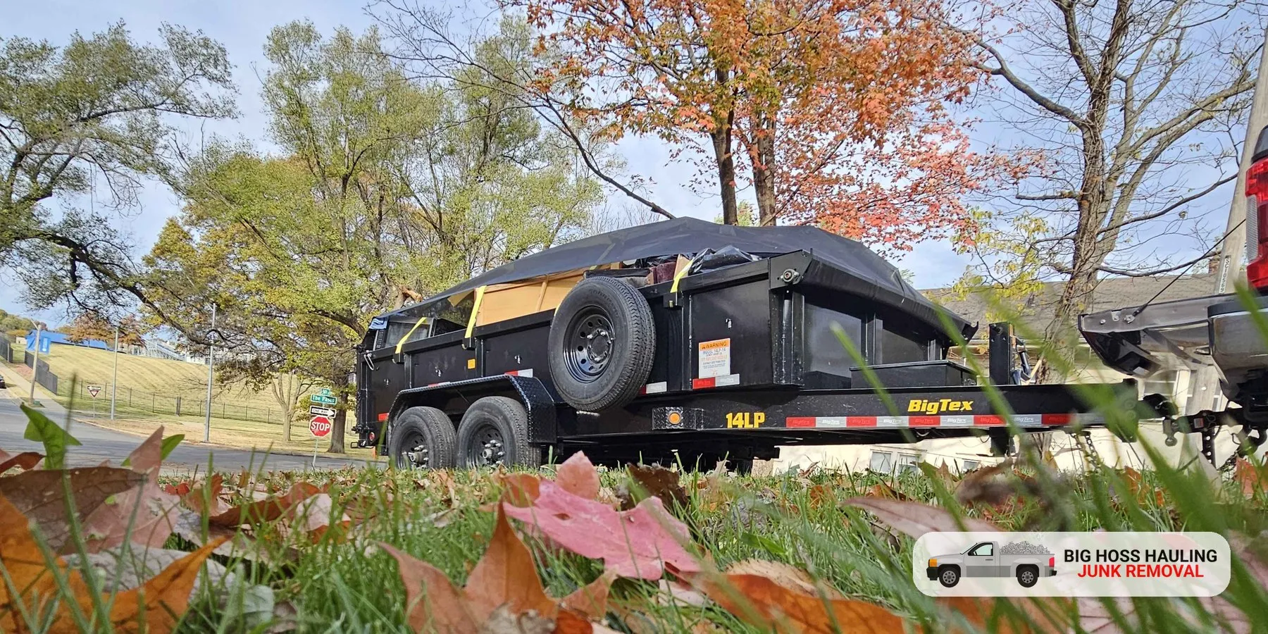 Covered trailer parked on an autumn day