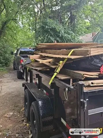 A trailer loaded with old lumber