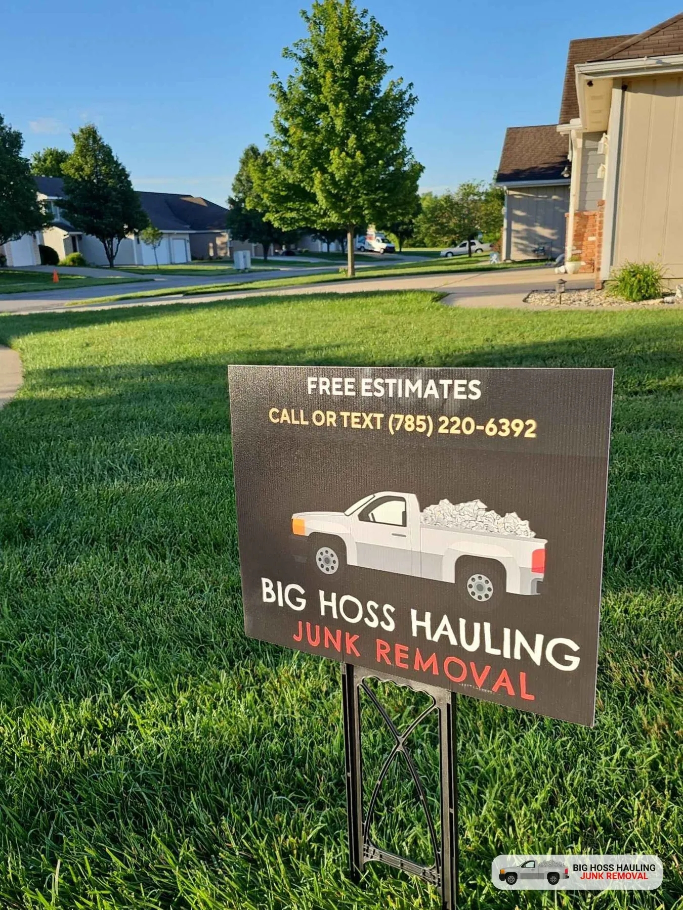 Big Hoss Hauling yard sign: free estimates, call or text